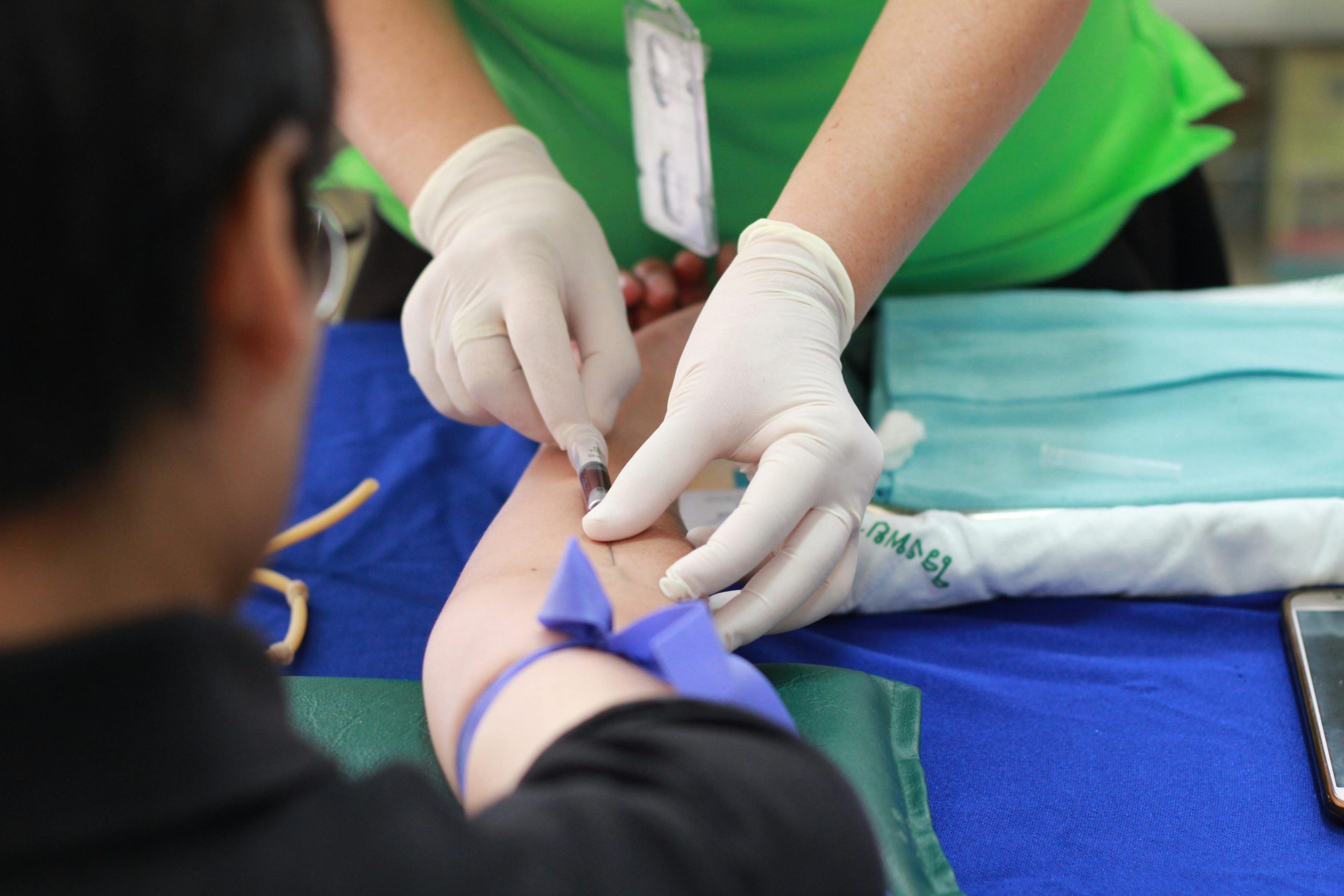 man taking a blood test