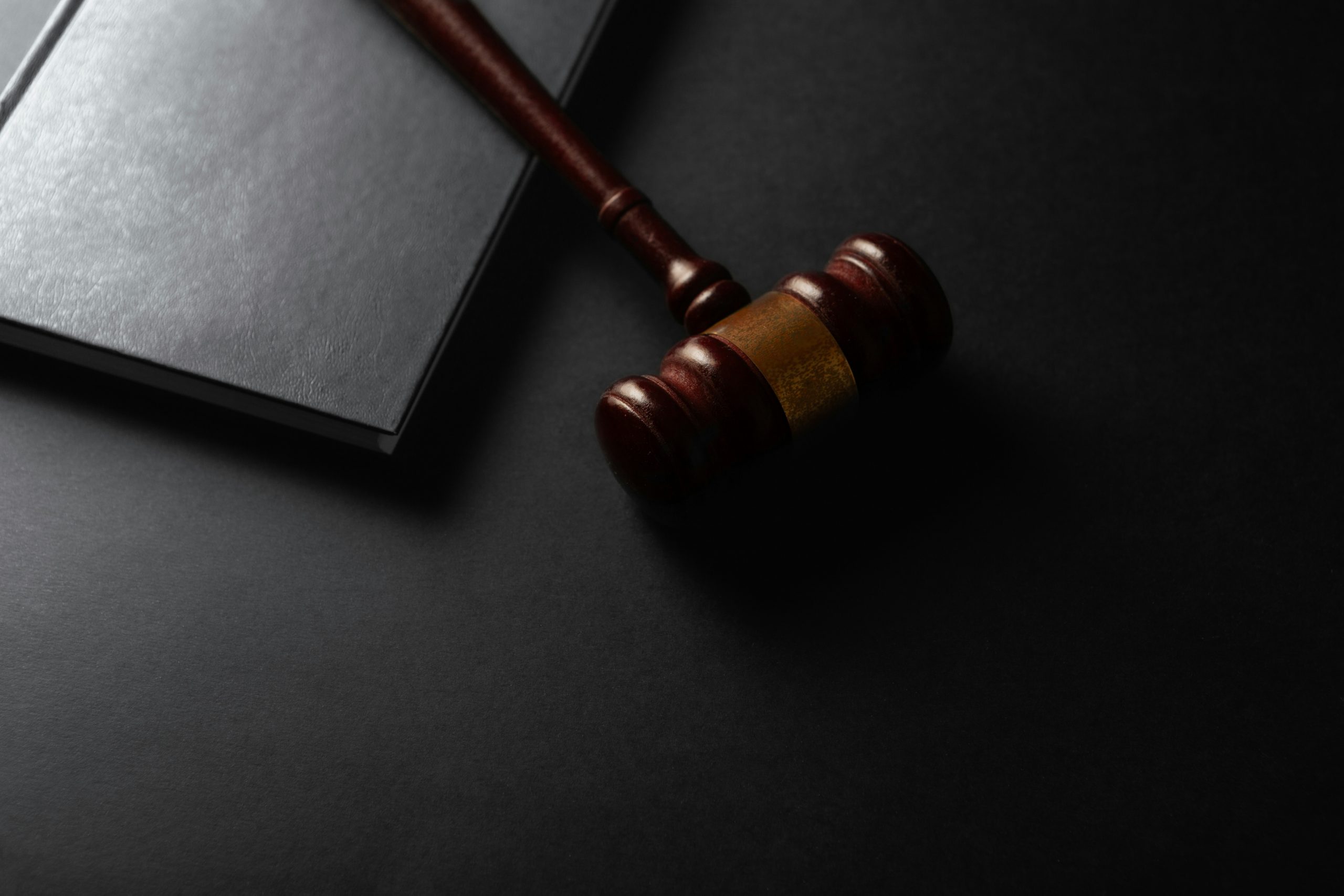 wooden gavel and law book
